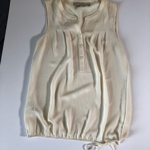 Cream Loft blouse with cinched waist and bow detail